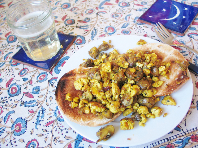 Christmas morning breakfast: scrambled mushroom tofu on a sesame bagel, and champagne :)